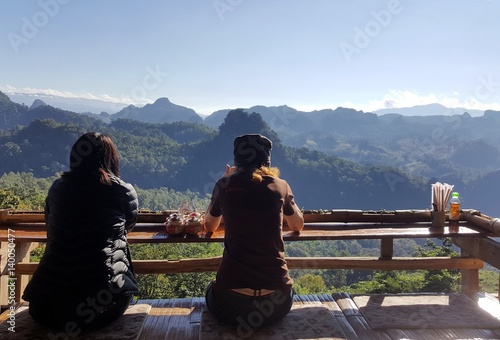 Two women relaxing at view point in the noodle shop at ban ja bo , Mae Hong Son, Thailand