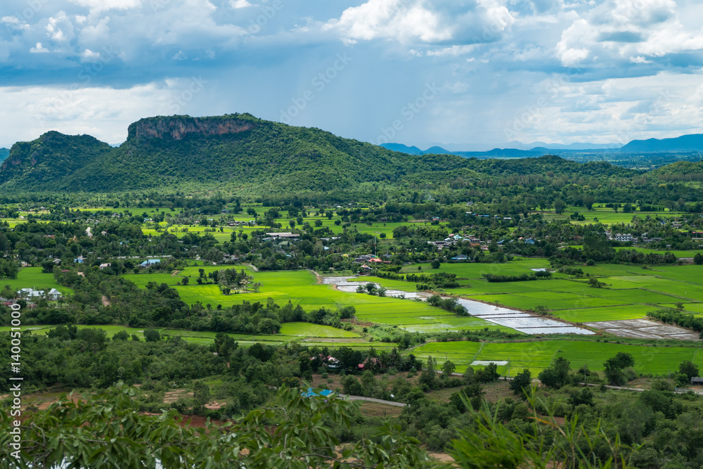 Thailand landscape of rural city and mountain under the cloudy sky,process color