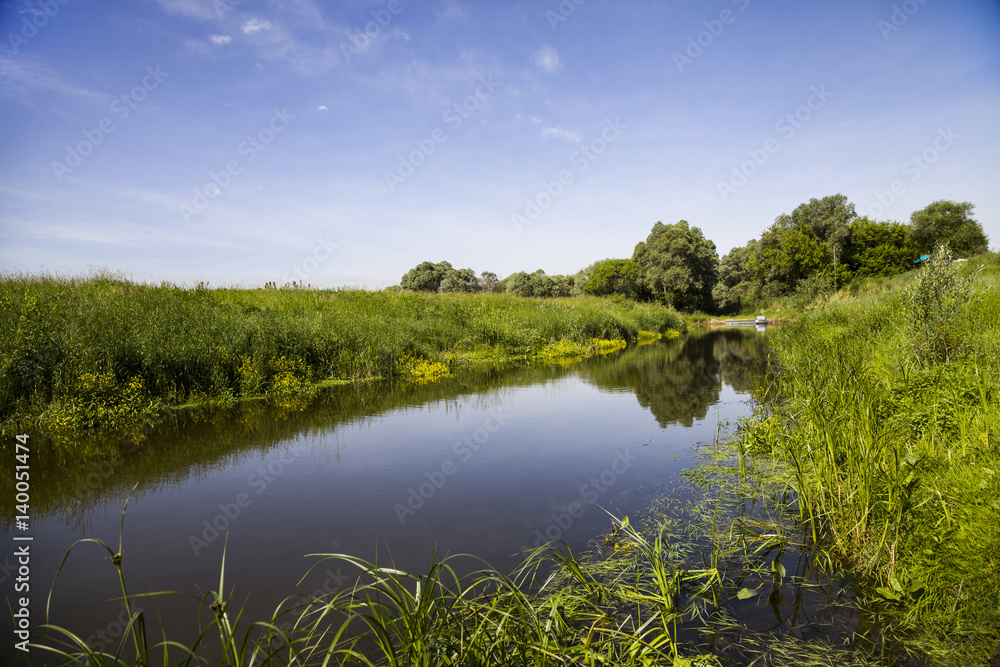Beautiful landscape with a small river Beautiful landscape with a small river