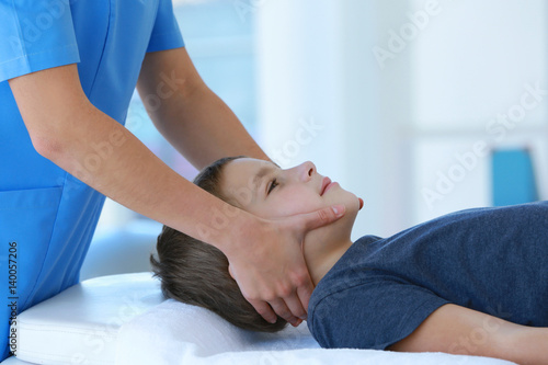 Physiotherapist working with patient in clinic, closeup