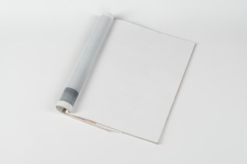Mock-up magazine or catalog on white table. Blank page or notepad on neutral background. Blank page or notepad for mockups or simulations.