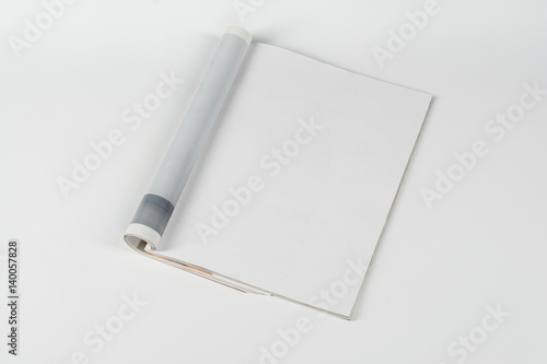 Mock-up magazine or catalog on white table. Blank page or notepad on neutral background. Blank page or notepad for mockups or simulations. photo