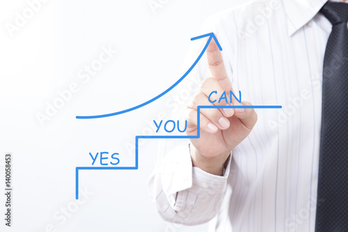 Businessman tap arrow pointing up with Yes You Can - Motivation Business Concept