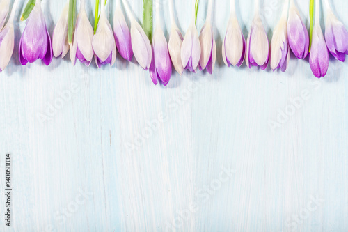 Bouquet of crocuses on a wooden table