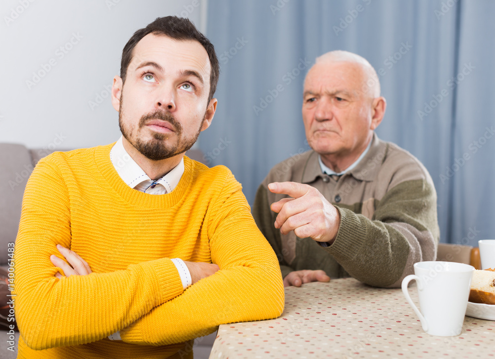Fototapeta premium Aged father teaches his son