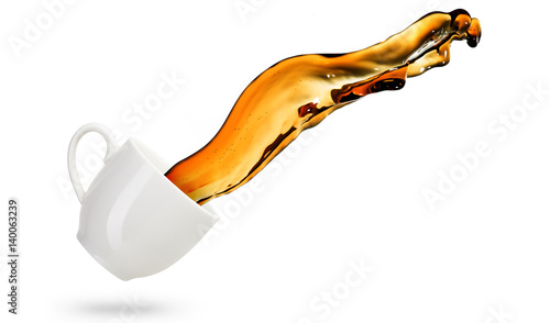 wave of coffee out of a cup isolated on white background