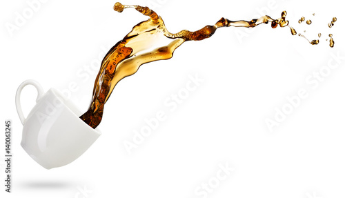 coffee spilling out of a cup isolated on white background