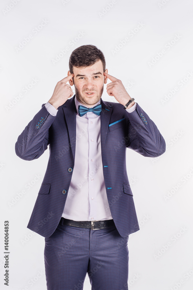businessman gesturing with his finger against temple asking are you crazy? emotions, facial expressions, feelings, body language, signs. image on a white background. businessman gesturing with his finger against temple asking are you crazy? emotions, facial expressions, feelings, body language, signs. image on a white background.