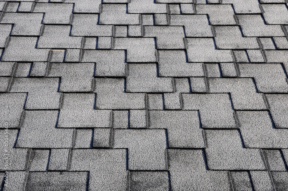 Close up view on Asphalt Roofing Shingles Background. Roof Shingles - Roofing. Roof shingles covered with frost Close up view on Asphalt Roofing Shingles Background. Roof Shingles - Roofing. Roof shingles covered with frost