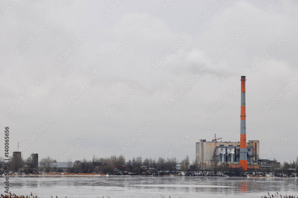 Obraz premium Waste incinerator plant with smoking smokestack. The problem of environmental pollution by factories