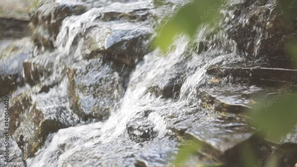 Closeup The water flows down the rocks Closeup The water flows down the rocks
