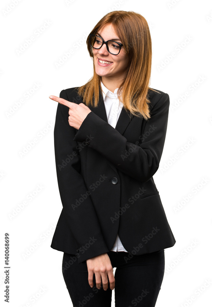 Young business woman pointing to the lateral Young business woman pointing to the lateral