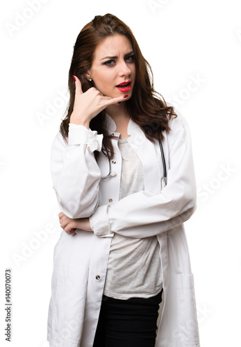Doctor woman making phone gesture