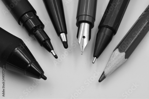 Different tips of pens for graphics illustrators: marker pen, fountain pen, pencil, digital pen.