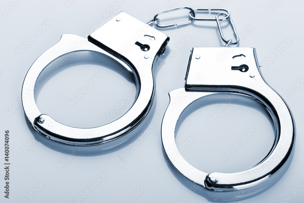 Pair of handcuffs on white Pair of handcuffs on white