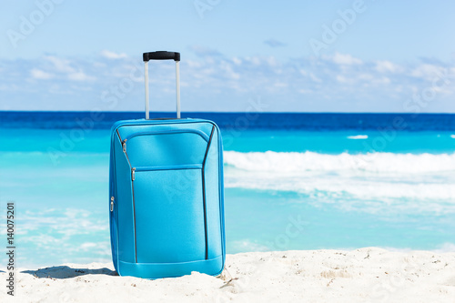 Travel trolley on tropical seaside