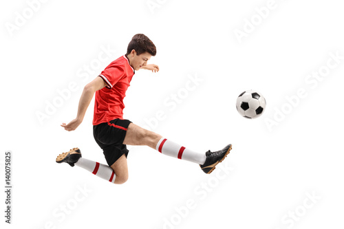 Teenage soccer player kicking a football © Ljupco Smokovski