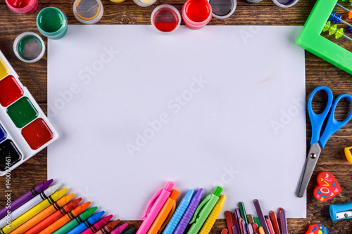 various stationery items on a wooden background with space for text top view 