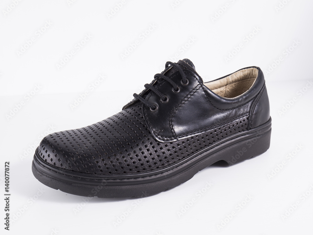 Black leather boot on white background, isolated product. Black leather boot on white background, isolated product.