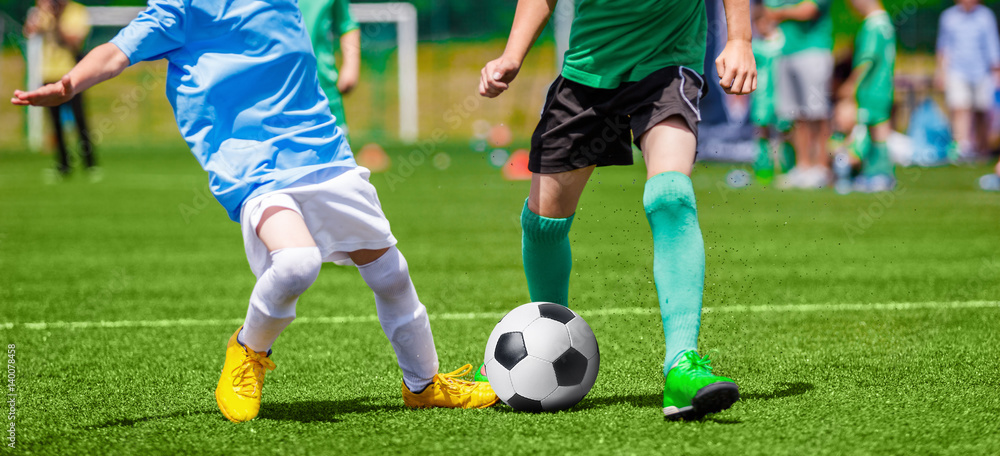 Football Soccer Match for Children. Kids Playing Soccer Game Tournament. Boys Running and Kicking Football on the Sports Grass Field