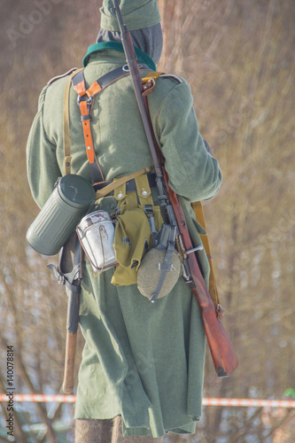 in winter, German soldiers with ammunition, from behind.