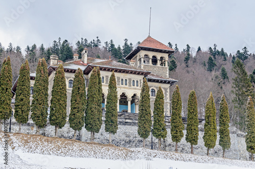 The Cantacuzino Palace (Palatul Cantacuzino) from Busteni, Romania, winter time with snow and ice