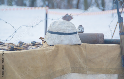 close-up, German helmet and a belt-fed weapon world war II.