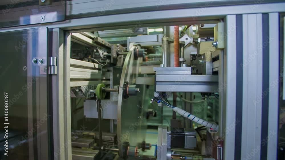 Observing the work of the machinery in the factory through the window. The production of particles.
Observing the work of the machinery in the factory through the window. The production of particles.