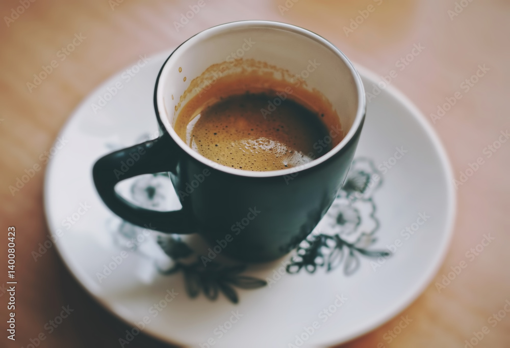 Cup of fresh morning espresso coffee with a beautiful thick tiger crema, close up view Cup of fresh morning espresso coffee with a beautiful thick tiger crema, close up view