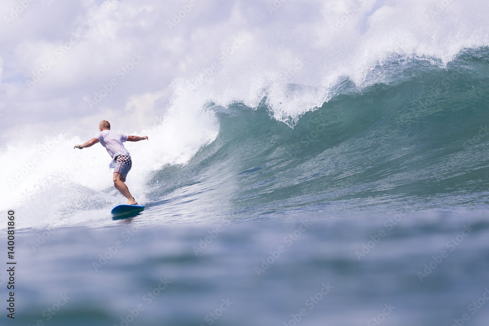 Indonesia, Bali, man surfing on a wave Indonesia, Bali, man surfing on a wave