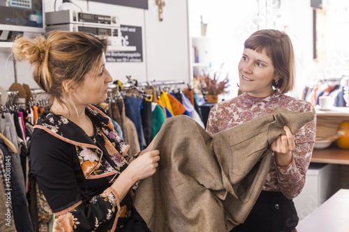 Two women in a second hand shop