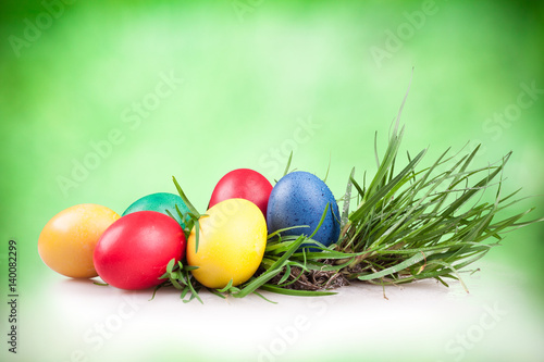 Easter colored eggs in the grass
