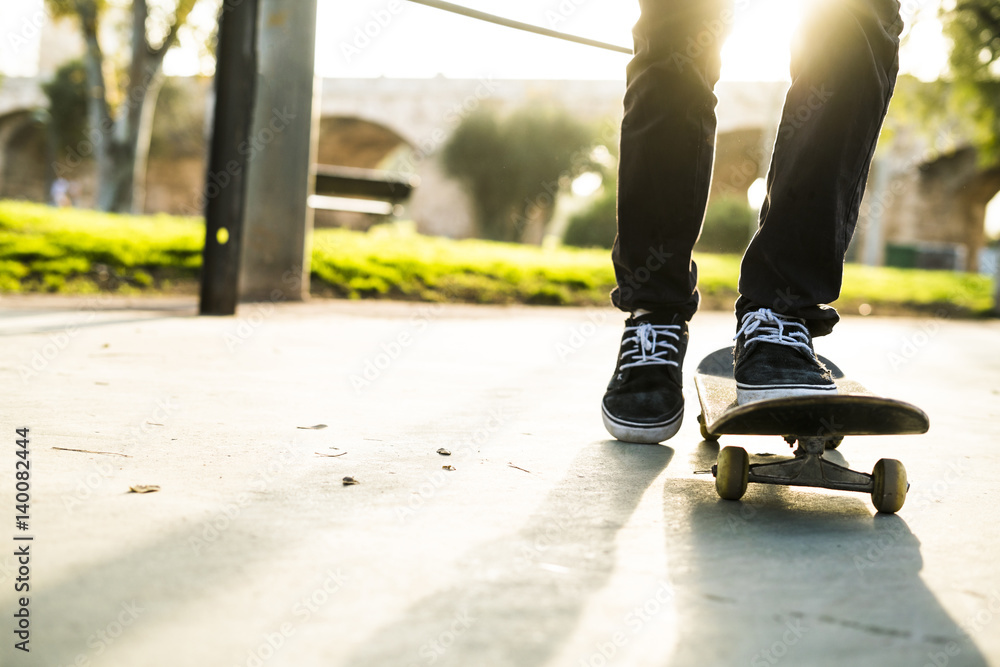 Legs of a skateboarder in a skatepark Legs of a skateboarder in a skatepark
