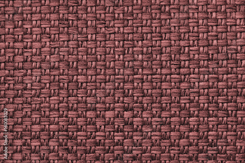 Brown textile background with checkered pattern, closeup. Structure of the fabric macro.