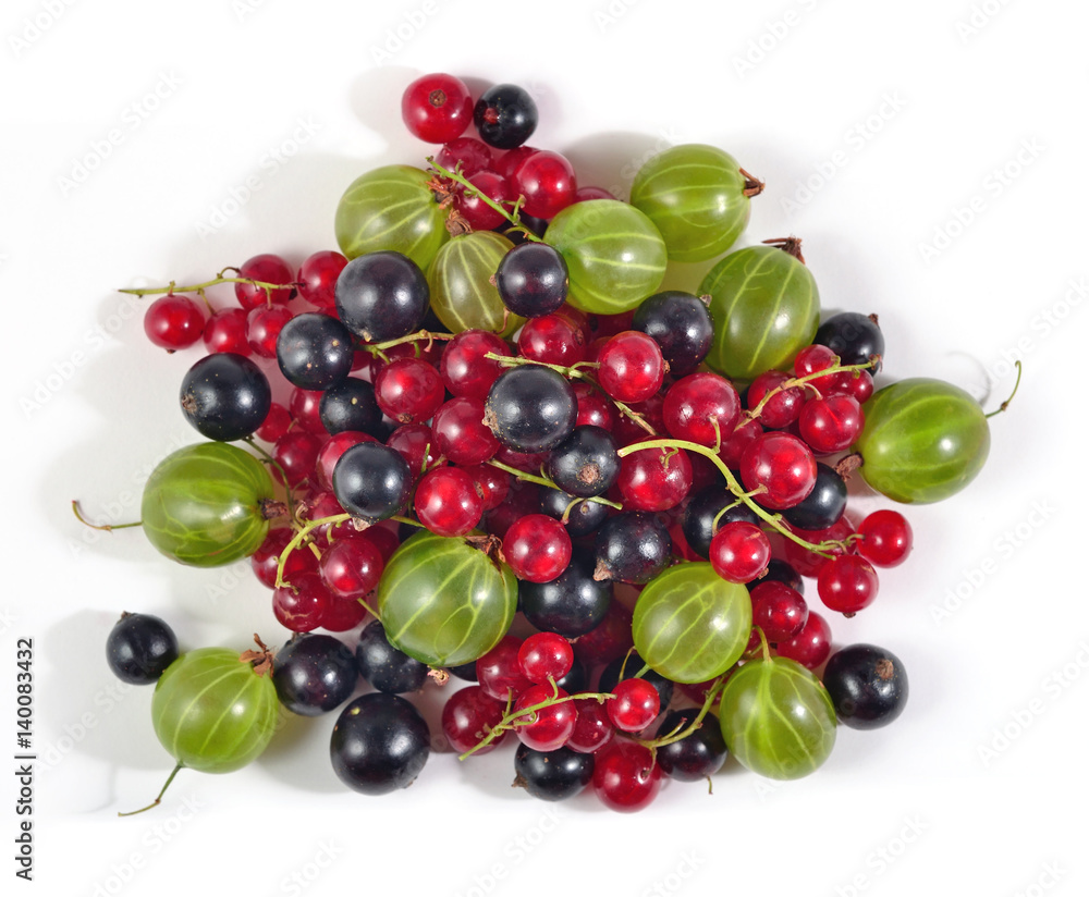 Heap of various kinds of fresh berries on a white Heap of various kinds of fresh berries on a white