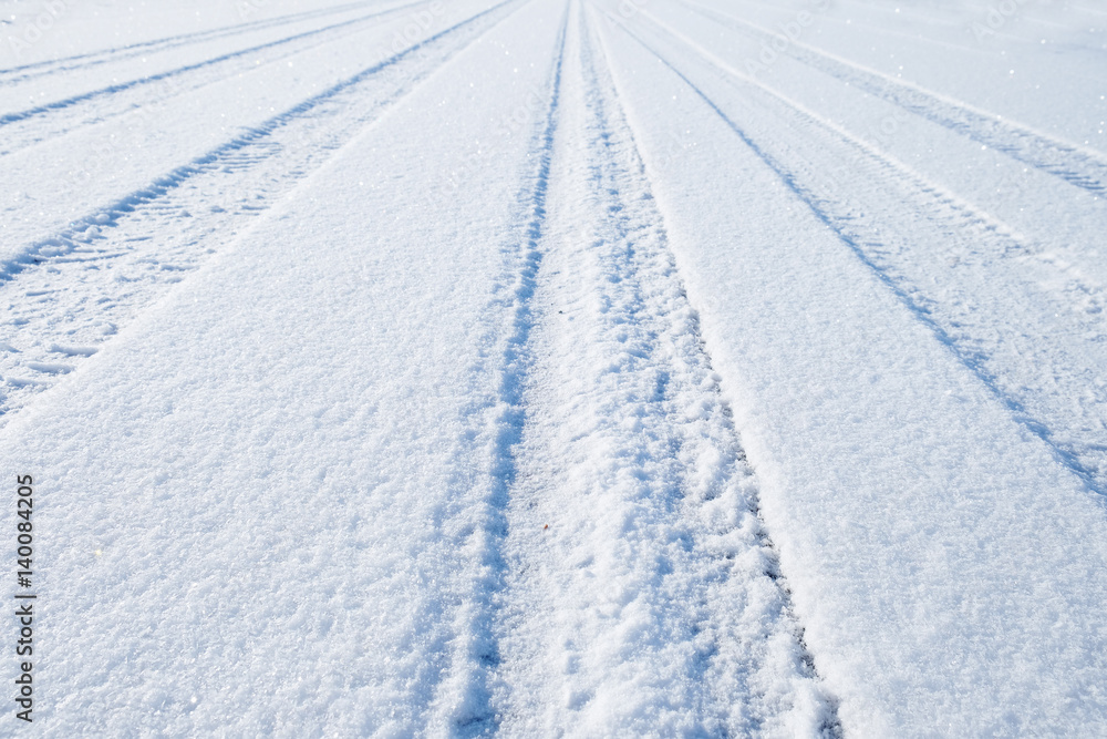 traces of cars on the freshly fallen snow