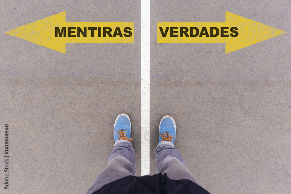 Mentiras e verdades, Portuguese text for Lies and Truth on asphalt ground, feet and shoes on floor