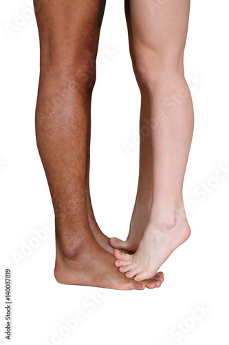 Legs of couple kissing - isolated on white background
