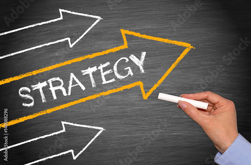 Strategy - arrow with text on blackboard background