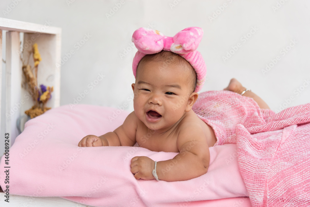 happy laughing child lies on bed. happy laughing child lies on bed.