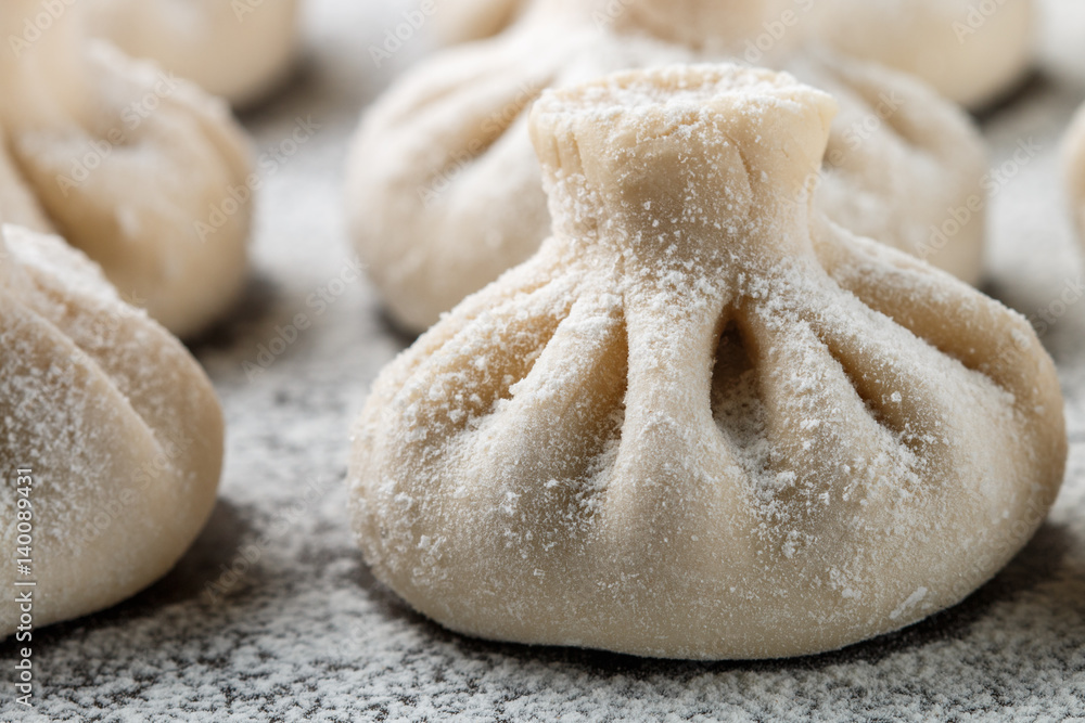 Khinkali is the national dish of Georgian cuisine. Products meat and dough with spices. Selective focus Khinkali is the national dish of Georgian cuisine. Products meat and dough with spices. Selective focus