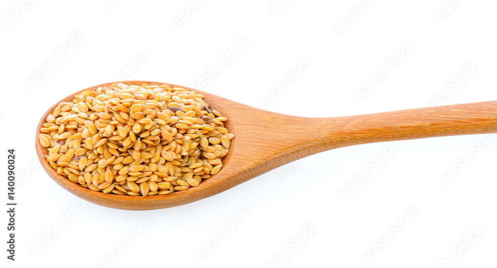 Flax seeds heap in wood spoon isolated on white background Flax seeds heap in wood spoon isolated on white background