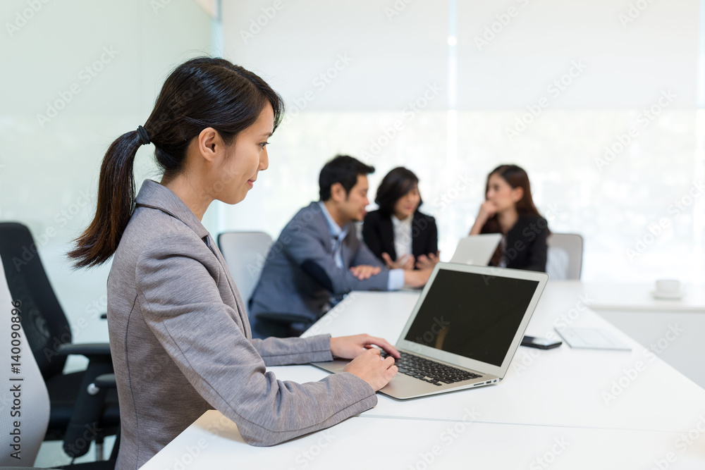 Business people working together at a meeting Business people working together at a meeting