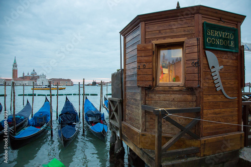 Venezia, gondole ormeggiate e casotto di legno photo