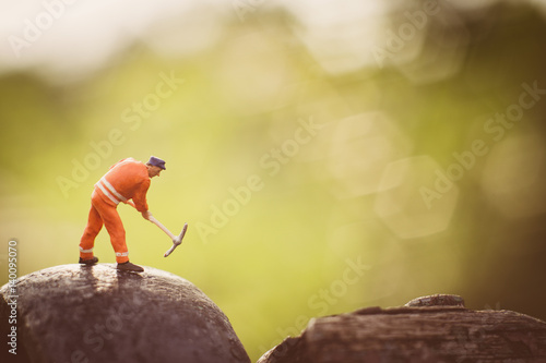 Miniature people engineer used for concept work hard