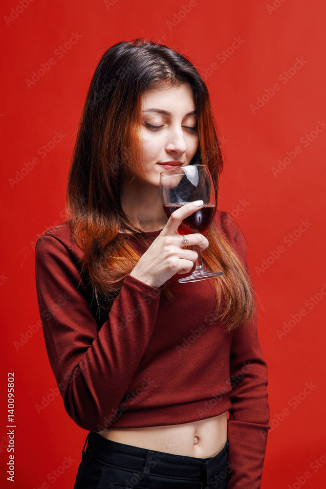 Woman with glass of red wine ih her hand Woman with glass of red wine ih her hand