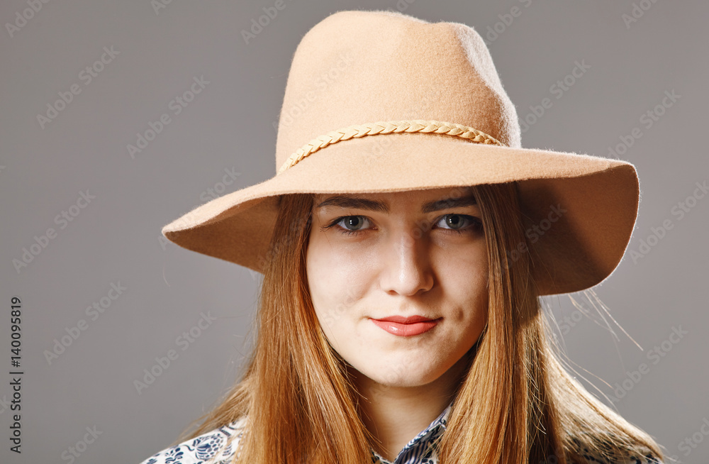 Woman in beige hat
