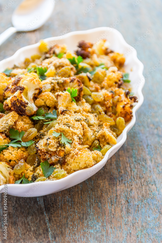 Roasted Crispy Cauliflower with Herbs and Raisins Vertical Image.