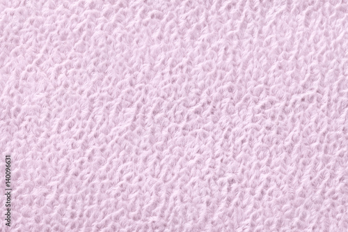 Light purple fluffy background of soft, fleecy cloth. Texture of textile closeup.