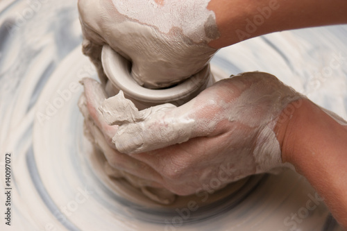 Artist working with Pottery